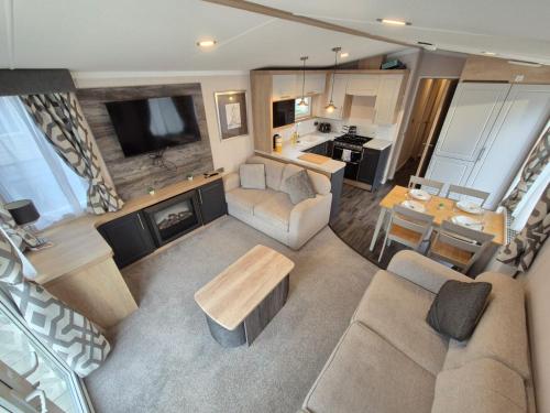 an overhead view of a living room with a couch and a table at Birchington Vale - Sleeps 8, Family friendly in Birchington