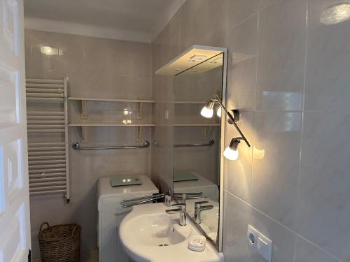 a bathroom with a sink and a mirror at Torre a Sant Martí d'Empúries in L'Escala