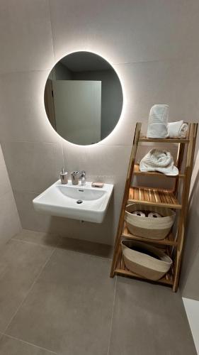 a bathroom with a sink and a mirror at La Tejita "Vida" by BE HAPPY in La Tejita