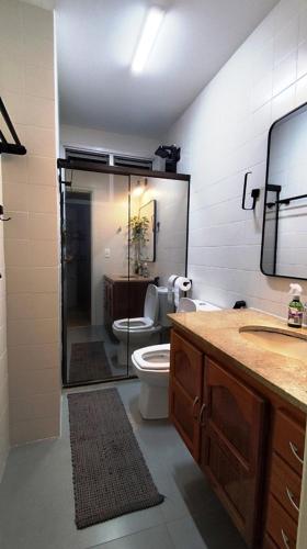 a bathroom with a shower and a toilet and a sink at Prince 1513 in Vitória