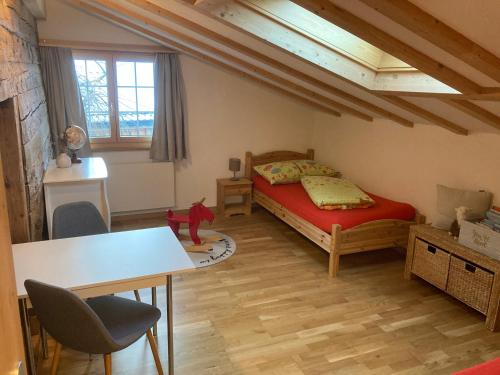 a bedroom with a bed and a table and chairs at Wies in Stein
