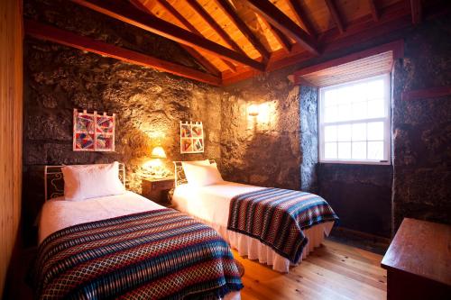 Posteľ alebo postele v izbe v ubytovaní Adegas do Pico