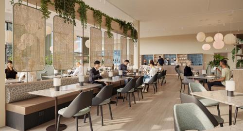 a restaurant with people sitting at tables at Thon Hotel Drammen in Drammen