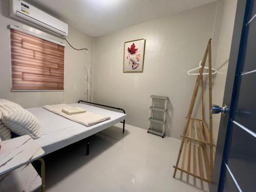 a hospital room with a bed and a window at Hayat Apartment Digos City in Dawis