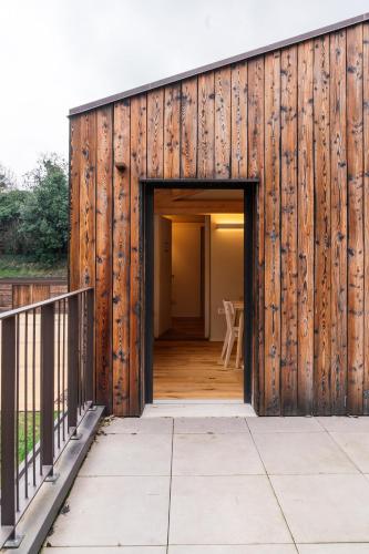 a wooden building with an open door at Locanda dell'Ortolano in Ferrara
