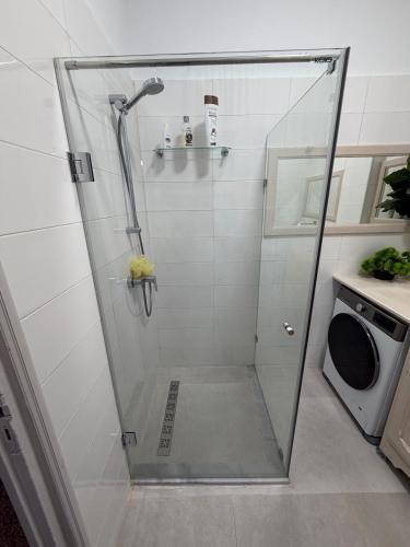 a shower with a glass door in a bathroom at Casa Shala in Tunis