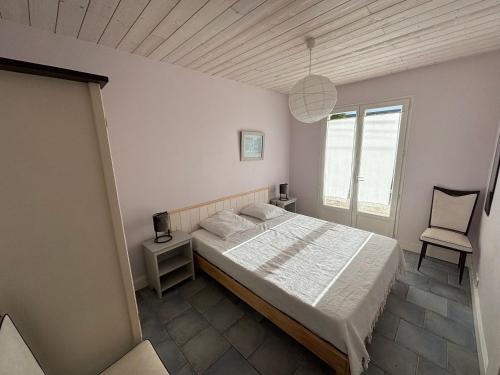 Vuode tai vuoteita majoituspaikassa Maison Ustou46