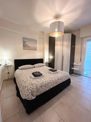 a bedroom with a large bed in a room at Gardenia Guest House in Marina di Massa