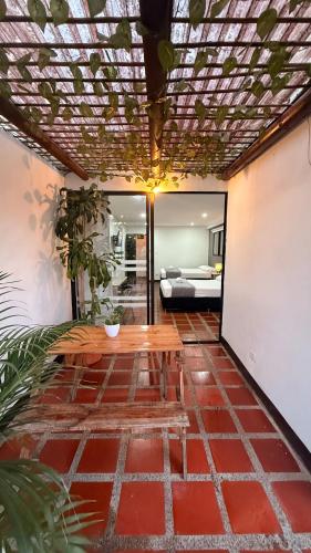 a living room with a table and a couch at Hotel CSI Llanogrande in Rionegro