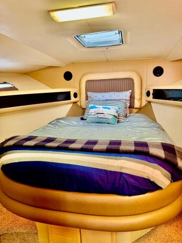 a bed in the back of a boat at Relation Ship in Onekama