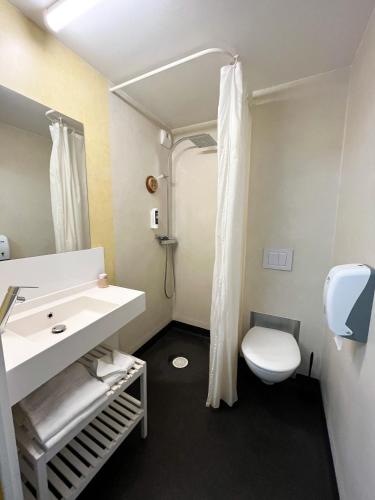 a bathroom with a sink and a toilet at The People - Tours in Tours