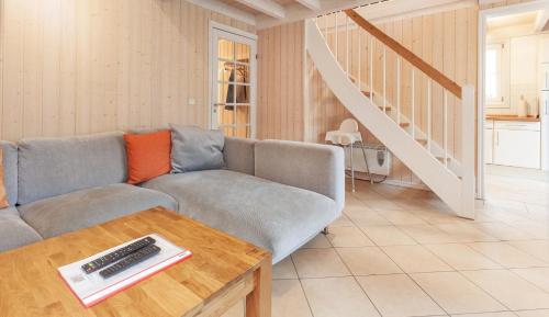 a living room with a couch and a table at Sekobbe 218 - Baabe in Baabe