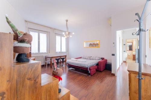 a living room with a couch and a table at Sempione Color Milano CityLife Fiera District in Milan