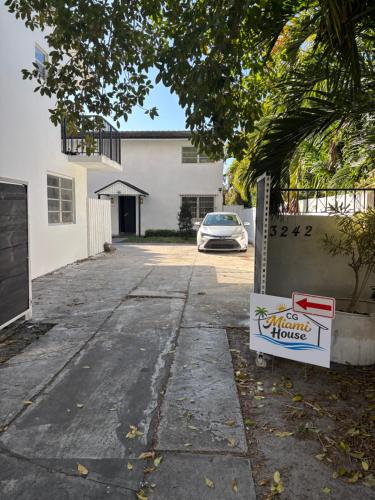 a car parked in the driveway of a house at CG Miami House in Miami