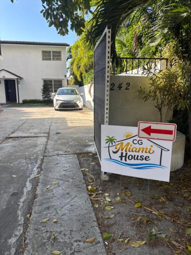 a sign for a mantis house in a driveway at CG Miami House in Miami