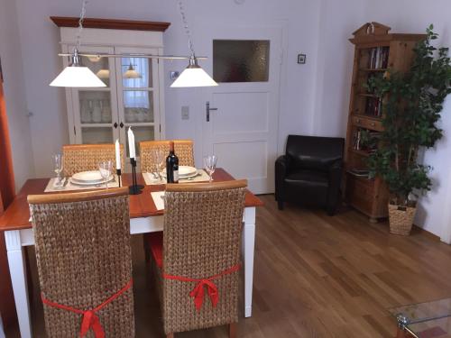 a dining room with a wooden table with chairs at Ihr Domizil auf Zeit in Würzburg in Würzburg