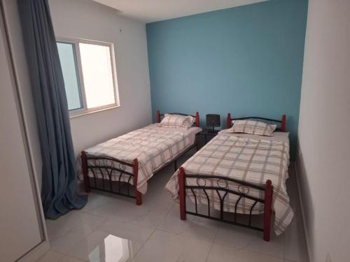 En eller flere senge i et værelse på Tdois