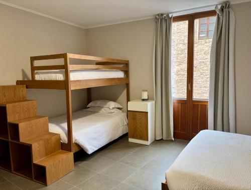 a bedroom with two bunk beds and a bed at Camere di Bianca in Foligno