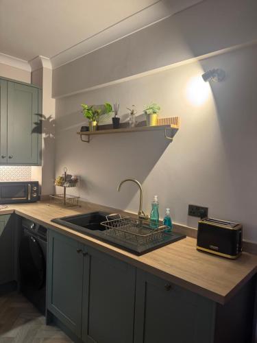 a kitchen with a sink and a counter top at Half Moon Nest - Refurbished throughout for 2026 in Diss