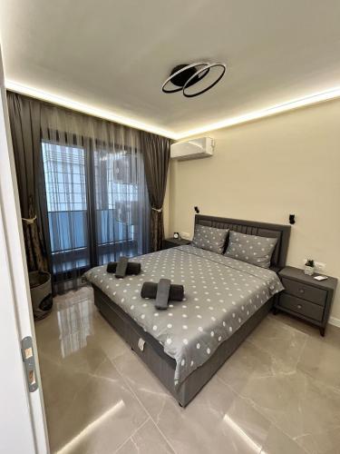 a bedroom with a large bed in a room at Le bijou Lauta Forest in Plovdiv