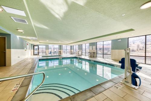 a large swimming pool in a building at Holiday Inn Express & Suites - Manitou Springs by IHG in Manitou Springs