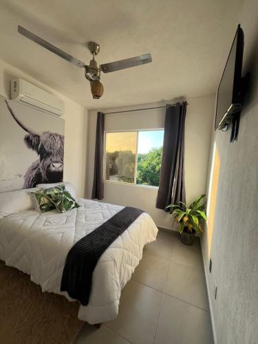 a bedroom with a bed and a large window at CASA CON ALBERCA Rodeada de NATURALEZA in Naranjo