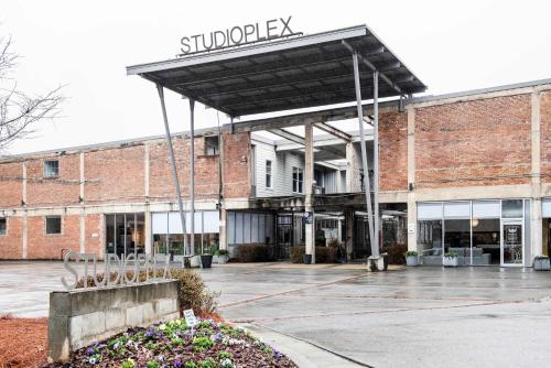 an empty parking lot in front of a brick building at Beltline Shrine in Atlanta