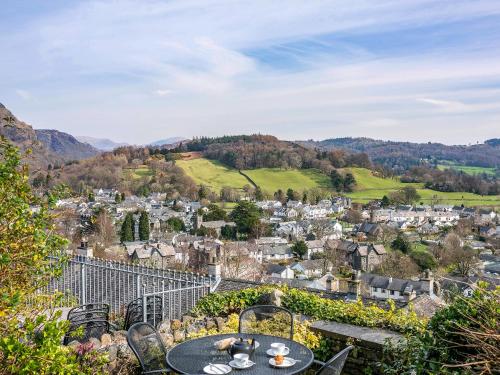 a view of a town with a table and chairs at Carrie's Gate in Coniston