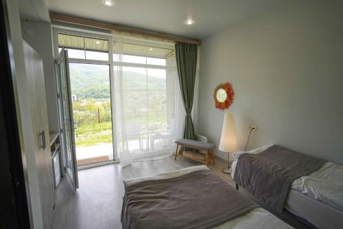 Postel nebo postele na pokoji v ubytování Chamich Guesthouse