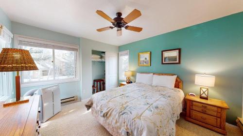 a bedroom with a bed and a ceiling fan at Bluff Condo 4015 in Sun Valley