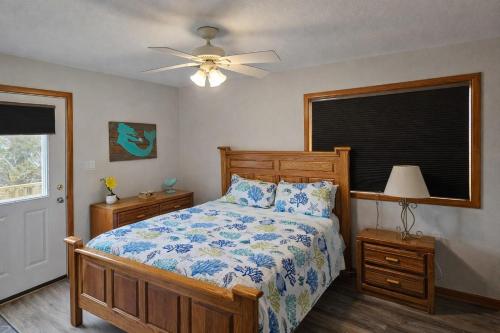 a bedroom with a bed and a ceiling fan at KH4112-Resting Beach Face in Kitty Hawk