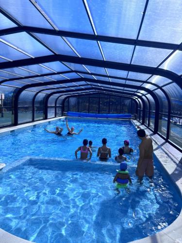 a group of people in a swimming pool at Casa Rural Puente del S,egura in Elche de la Sierra