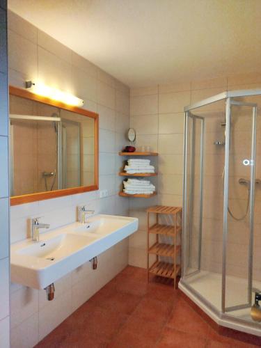 a bathroom with a sink and a shower at Ebner Casa in Heiligenblut