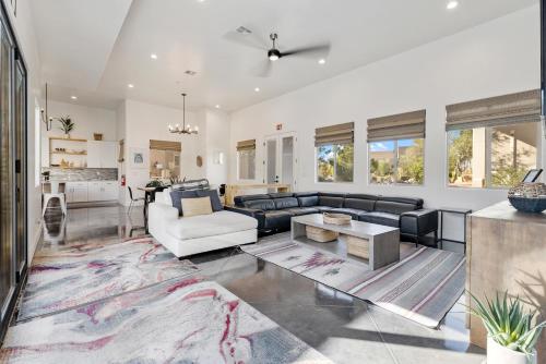 a living room with a couch and a table at Azure Abode at Sand Hollow Resort in Hurricane