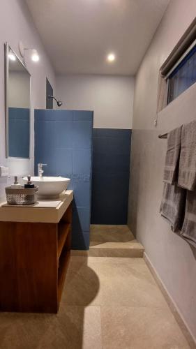 a bathroom with a sink and a mirror at Casa Celeste in Playa Pelada