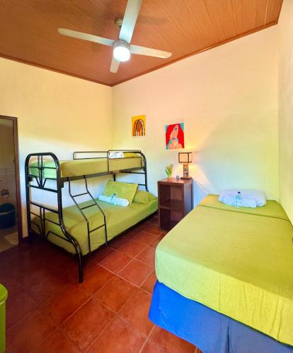 a bedroom with two bunk beds in a room at Casa Lula León Hostal in León