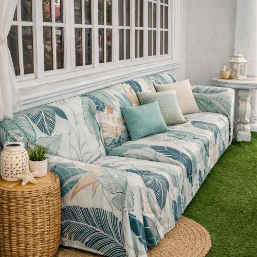 a blue and white couch in a living room at Crieta Costello Homestay in San Juan