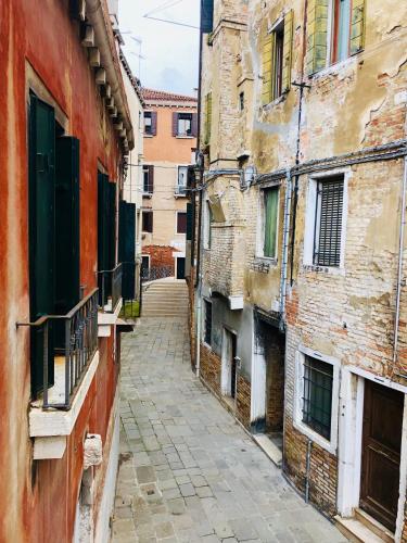 an alley in an old city with buildings at Cà Fede in Venice