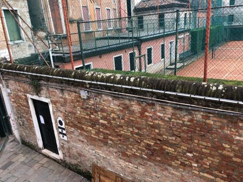 a brick wall with a door on top of it at Cà Fede in Venice