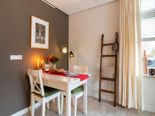 a dining room with a white table and chairs at Apartment in Bergen near Sandy Beaches in Bergen