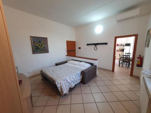 a bedroom with a bed in the corner of a room at Appartamento Ferrara nord in Ferrara