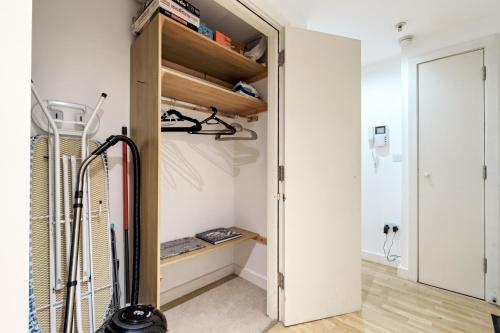 a room with a closet with a door open at Glasgow City Flats in Glasgow