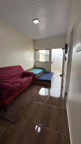 a bedroom with two beds and a large window at Casa privativa Próximo a Itaipu in Foz do Iguaçu