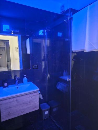 a bathroom with a shower and a sink and a mirror at BENNY'S MOUNTAIN b&b in Pescocostanzo
