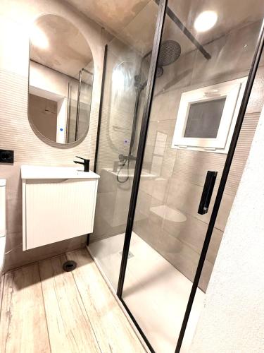 a bathroom with a shower and a sink at DUPLEX IN TARIFA'S OLD TOWN in Tarifa