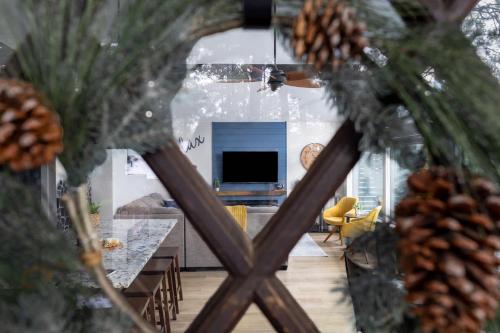 a view of a living room with a christmas tree at Pine Cone Cabin Flagstaff 3BR 2BA in Flagstaff