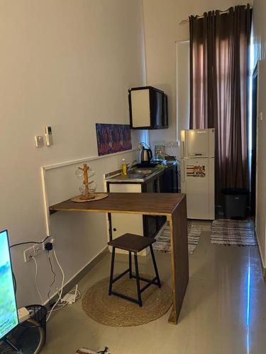 ครัวหรือมุมครัวของ Single room Jimi