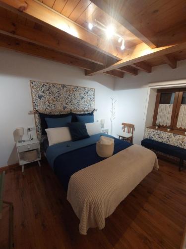 a bedroom with a large bed in a room at Casa Nayala in Río Aller