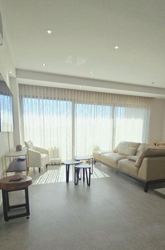 a living room with a couch and a table at Luxury Condo Residencial Area Close to Everything in Puerto Vallarta