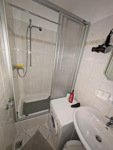 a bathroom with a shower and a sink at Bocksbergbande in Goslar